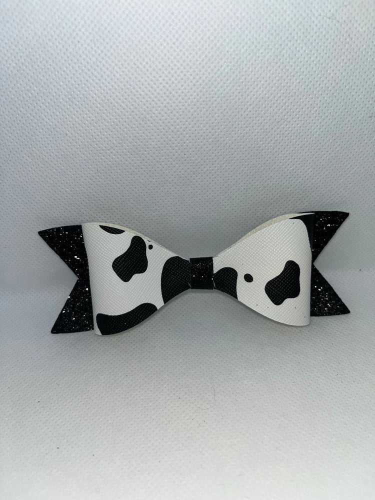 Cow print faux leather bow